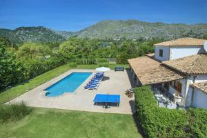 an overhead view of a pool with chairs and a house at NEW! Villa Orquidea - walking distance to Pollença village in Pollença