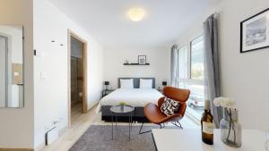 Letto o letti in una camera di Nonanteneuf appart hōtel Aigle - contactless check-in