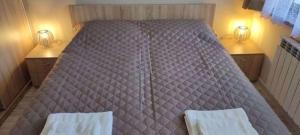 A bed or beds in a room at Borovets Gardens Apartment A27