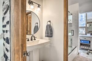 a bathroom with a sink and a mirror at Sunny Alpine Escape with Hot Tub and Mountain Vistas! in Fraser +22 photos
