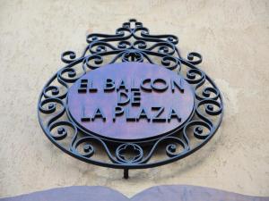 a sign on the side of a building at Hotel Boutique Balcón de la Plaza in Salta