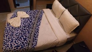 Postel nebo postele na pokoji v ubytování Riad Rayan's Guests