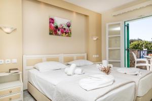 a bedroom with two beds with white sheets at Villa Harmony in Agia Anna Naxos +53 photos