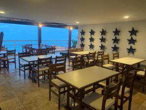 
A restaurant or other place to eat at Vip Praia Hotel
