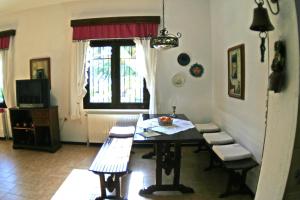 a dining room with a table and chairs at Villa Paradiso in Neos Marmaras +5 photos