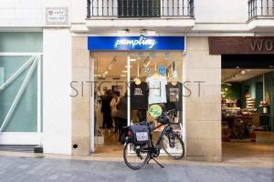 a bike parked in front of a clothing store at Sitges CENTRAL - En el corazón de Sitges in Sitges