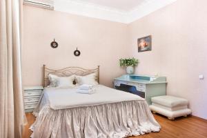 Postel nebo postele na pokoji v ubytování Basseynaya Apart Hotel