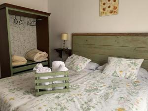 a bedroom with a large bed and a mirror at Casa Camino Real in Puerto de Béjar