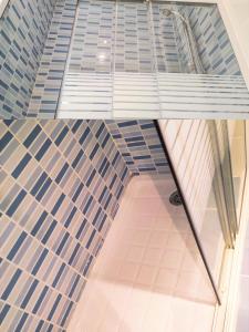 a view of a tile floor in a building at Apto IBAIONDO-Con encanto, céntrico y comunicado in Bilbao +19 photos