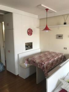 Posteľ alebo postele v izbe v ubytovaní Appartamento con vista unica Condominio Grand'Ourse