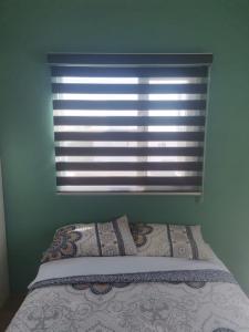 Un pat sau paturi într-o cameră la Montecarlo 2