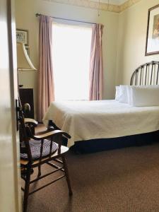 Katil atau katil-katil dalam bilik di The Palace Hotel