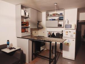 a kitchen with a counter top in a room at Lunita de Alberdi in Córdoba