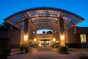 a large building with an archway in front of it at Sheraton Milwaukee Brookfield in Brookfield