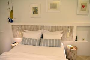 Posteľ alebo postele v izbe v ubytovaní Gallery Suites Parga