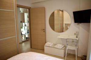 Posteľ alebo postele v izbe v ubytovaní Gallery Suites Parga