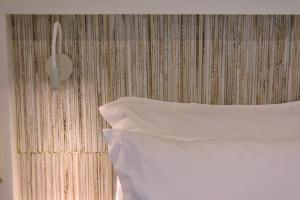 Posteľ alebo postele v izbe v ubytovaní Gallery Suites Parga