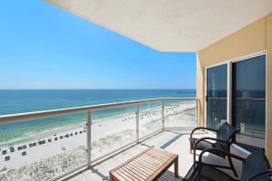 a balcony with a view of the beach and the ocean at Emerald Isle unit 1206 in Pensacola Beach