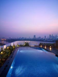 a swimming pool on the roof of a building at Park Plaza Sukhumvit Bangkok in Bangkok