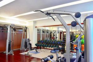 a gym with lots of machines and a mirror at Park Plaza Beijing Science Park in Beijing
