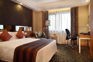 a hotel room with a bed and a desk at Park Plaza Beijing Science Park in Beijing +112 photos