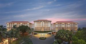 una representación de un edificio resort con una puesta de sol en el fondo en Taj Samudra, en Colombo