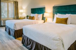 Postel nebo postele na pokoji v ubytování L3 Oasis Hotel