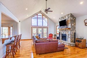 a living room with a couch and a fireplace at Everview in Waynesville