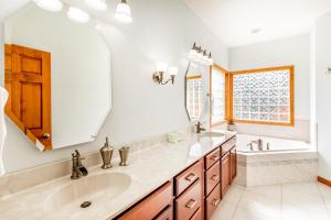 a bathroom with two sinks and a large mirror at Everview in Waynesville +24 photos