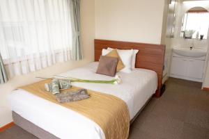 En eller flere senge i et værelse på Outlet Hotel UenoEkimae