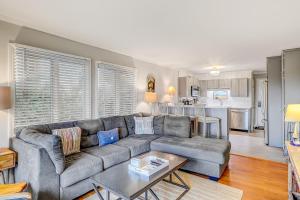 a living room with a couch and a table at Beachwood Place 1H in Hilton Head Island