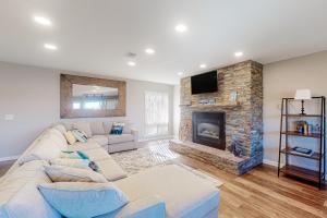 a living room with a couch and a fireplace at Wildernest Rest in Silverthorne