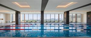 a swimming pool with a view of a building at Shangri-La Putian in Putian