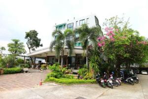 a group of motorcycles parked in front of a building at Platinum Place in Bangkok