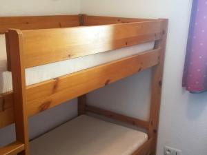 a wooden bunk bed in a room at Appartement Saint-François-Longchamp, 2 pièces, 4 personnes - FR-1-635-40 in Saint-François-Longchamp