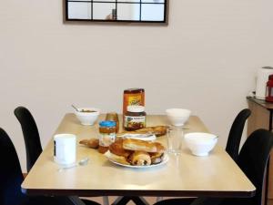 a table with a plate of food on it at Appartement Saint-François-Longchamp, 2 pièces, 4 personnes - FR-1-635-10 in Saint-François-Longchamp