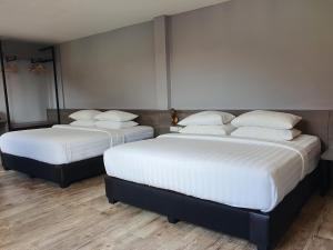 Postel nebo postele na pokoji v ubytování See Foo Hotel + 20 fotografií