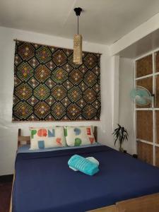 Postel nebo postele na pokoji v ubytování Purple Homestay Hillside