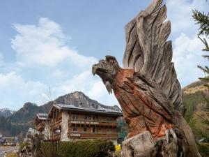 a statue of an eagle in front of a building at Apartment in Wald near Zillertal Ski Area in Wald im Pinzgau