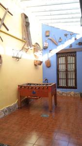 a ping pong table in the middle of a room at El Quinto Pino Riópar in Riópar