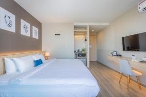 Postel nebo postele na pokoji v ubytování 56 Hotel
