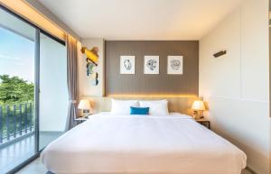 Postel nebo postele na pokoji v ubytování 56 Hotel