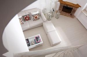 an overhead view of a living room with a couch and a fireplace at Villa Mariuccia Capri in Capri