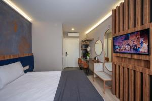 Ein Bett oder Betten in einem Zimmer der Unterkunft Seyithan Palace Spa Hotel