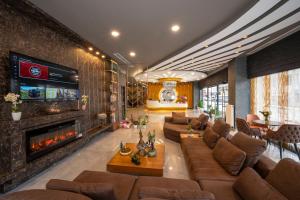 a living room with a couch and a fireplace at Seyithan Palace Spa Hotel in Istanbul