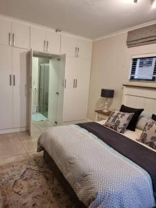 a bedroom with a large bed in a room at Bondi Beach Villa in Margate