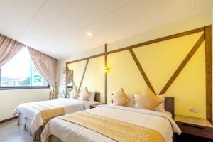 Llit o llits en una habitació de Chamie B&B