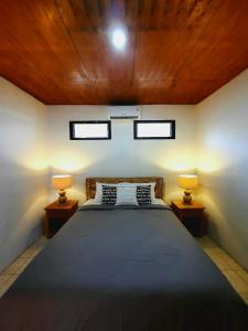 A bed or beds in a room at Jawato Homestay 1&2