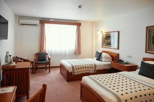 Giường trong phòng chung tại Winner Inn