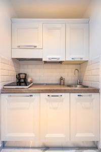 Virtuvė arba virtuvėlė apgyvendinimo įstaigoje ORA BLU Guest house